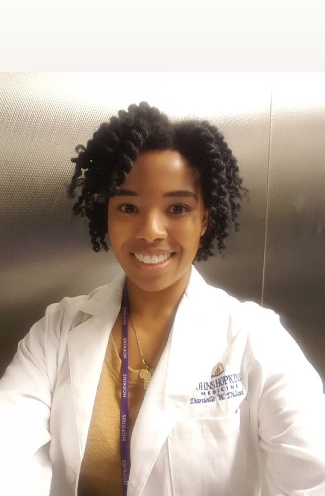 Family photo shared by Patricia: a daughter in a white lab coat