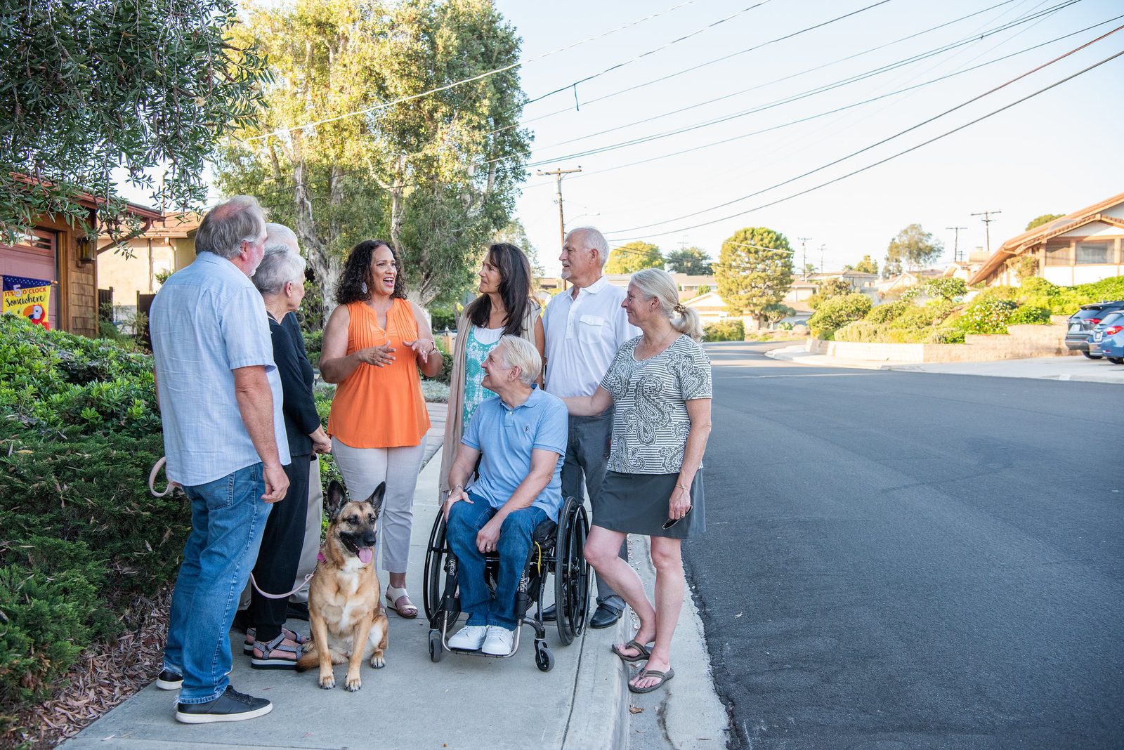 Patricia Dillard walking a La Mesa street with neighbors